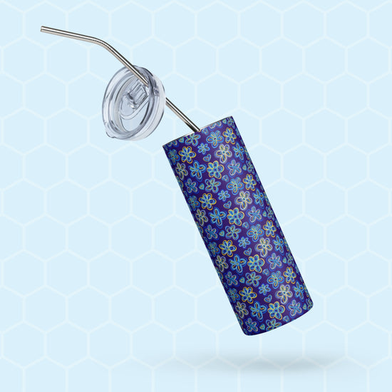 The Bloomscape Stainless Steel Tumbler by My Favourite Colour is Rainbow, a tall design with a metal straw, features a blue and yellow floral pattern.