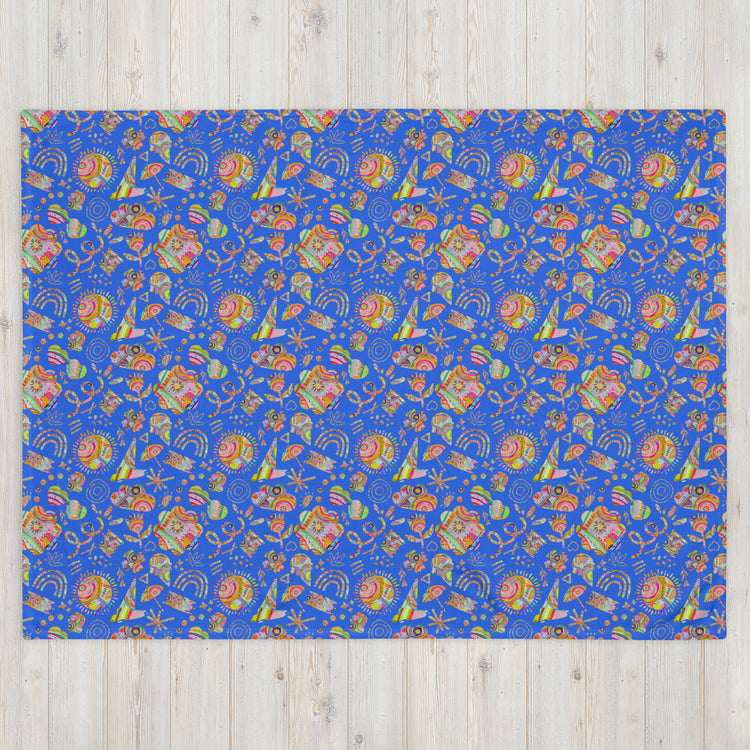 The Blue Summer Sorbet Throw Blanket by My Favourite Colour is Rainbow features a cosy blue design with symmetrical patterns, abstract shapes, stars, and swirls in lively orange, green, and purple.