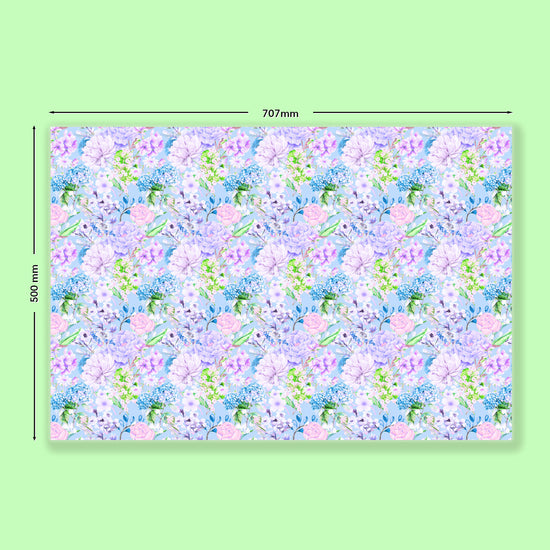 My Favourite Colour is Rainbows Floral Wrapping Paper Sheets measure 707mm by 500mm, featuring pastel pink, lavender, and green flowers on a light blue background.