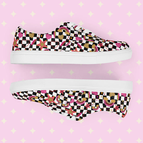 A pair of My Favourite Colour is Rainbows Galaxy Canvas Sneakers, decorated with a black and white checkerboard print, featuring gold, pink and red stars, hearts and rainbows.   They have white soles and laces.