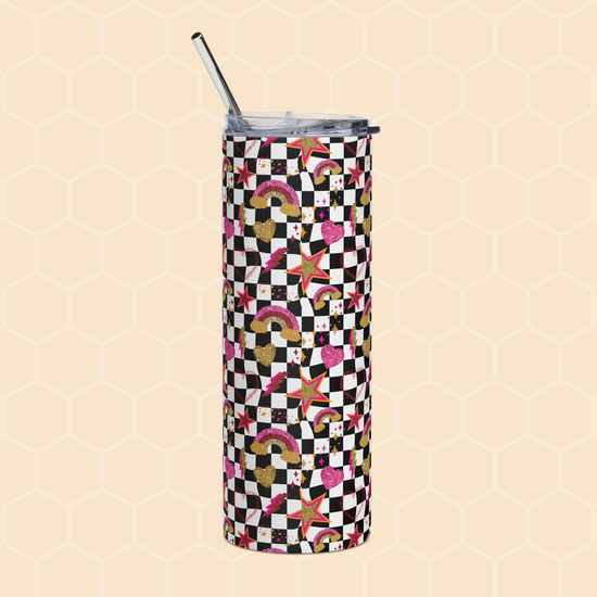 The Galaxy Stainless Steel Tumbler by My Favourite Colour is Rainbow is adorned with rainbows, hearts, stars, and black-and-white checkered squares on a light beige honeycomb background. It includes a tall form with a silver lid and metal straw.