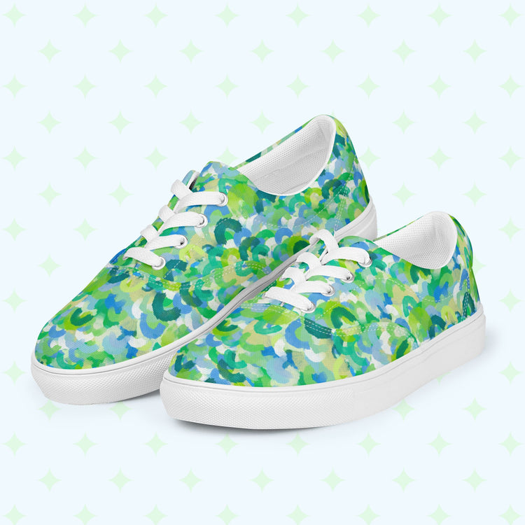Introducing the Green Rainbow Canvas Sneakers from My Favourite Colour is Rainbow, featuring blue, green, and white rainbows with white laces, eyelets, and soles.
