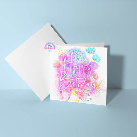 The Floral Happy Birthday Card by My Store features watercolor flowers and Happy Birthday in pink script. It stands open with a blank envelope on a light blue background, creating a charming celebratory scene.