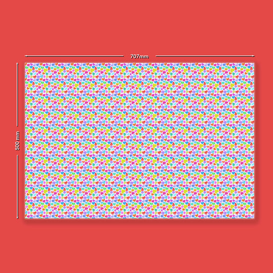 The Heart Attack Wrapping Paper Sheets by My Favourite Colour is Rainbow showcase a white rectangular sheet with vibrant red, blue, green, yellow, and pink polka dots on a bold red background. Measuring 707mm wide by 500mm tall, theyre perfect for eco-friendly gifting.