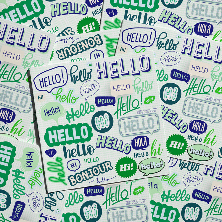 The Say Hello Greeting Card from My Store features a colorful collage of hello in different fonts and languages like hi, bonjour, and hola. It is styled in blue, green, and black on a patterned white background, making it perfect for any occasion.