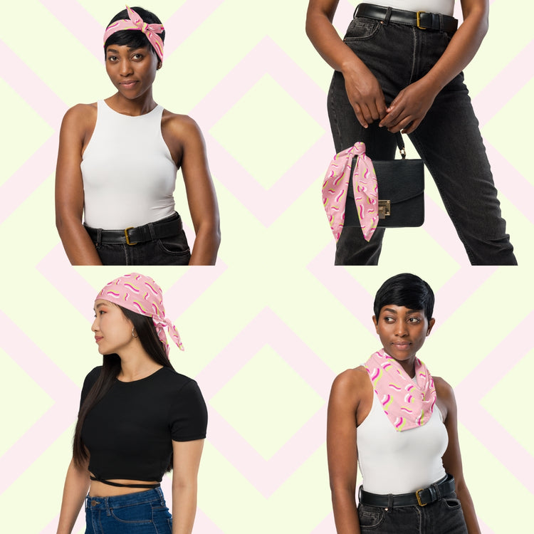 Four images show women styling the Iced Vovo Bandana by My Favourite Colour is Rainbow, showcasing its versatility as a headband, purse accessory, head wrap, and neck scarf. They wear casual outfits with neutral tops and denim.  The bandana features a pink background with white, hot pink and lime green wavy lines suggestive of the iconic Iced Vovo biscuit.