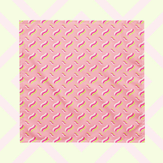 The Iced Vovo Bandana by My Favourite Colour is Rainbow features a pink background with white, hot pink and lime green wavy lines suggestive of the iconic Iced Vovo biscuit.