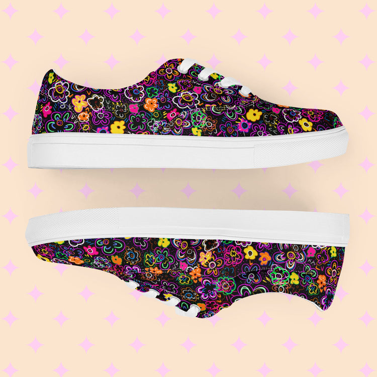 Side views of the In the Midnight Garden Canvas Sneakers by My Favourite Colour is Rainbow, featuring vibrant floral patterns on black backgrounds with white laces and soles.