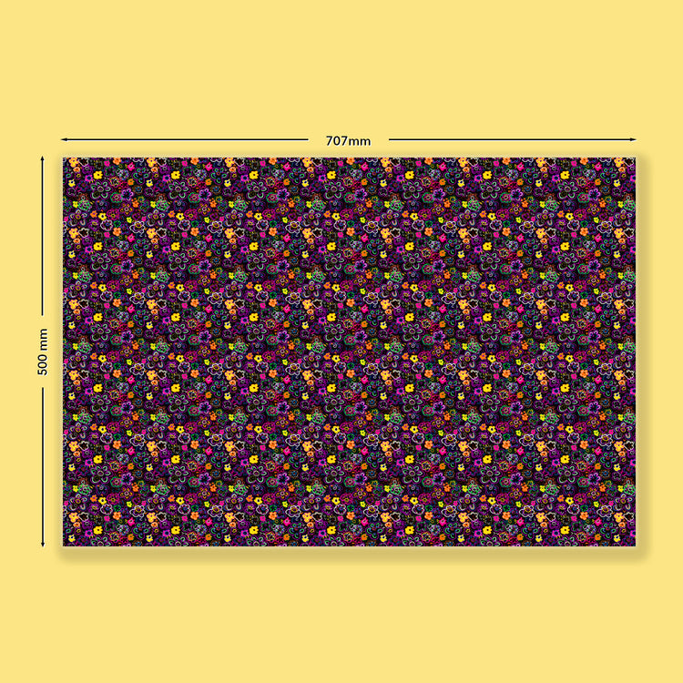The In the Midnight Garden Wrapping Paper Sheet by My Favourite Colour is Rainbow features dense neon flowers on a dark purple background, measuring 707mm x 500mm. Displayed on a solid yellow surface, dimensions are marked by arrows, making it perfect for wrapping gifts.