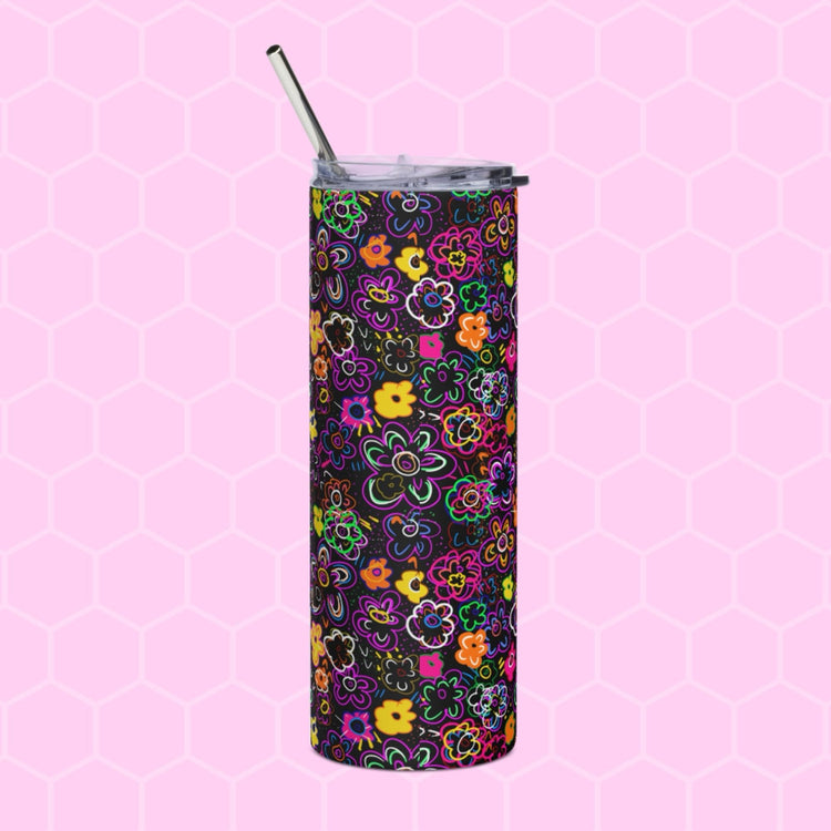 The In the Midnight Garden Stainless Steel Tumbler from My Favourite Colour is Rainbow features a vibrant floral pattern on a black background, complete with a lid and metal straw, perfectly enhanced by a pink hexagonal setting.