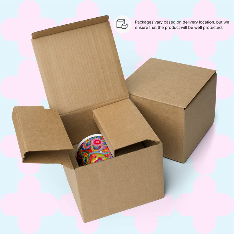 An open cardboard box displays a Love in Neon Mug, beside a closed box. Text reads, Packaging varies by delivery location, but we ensure the item is well protected.