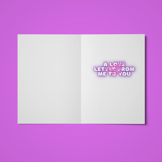 An open Love Letter Valentines card from My Store is set against a purple background, featuring the phrase A Love Letter From Me To You in pink and white on the right page, radiating rainbow joy.