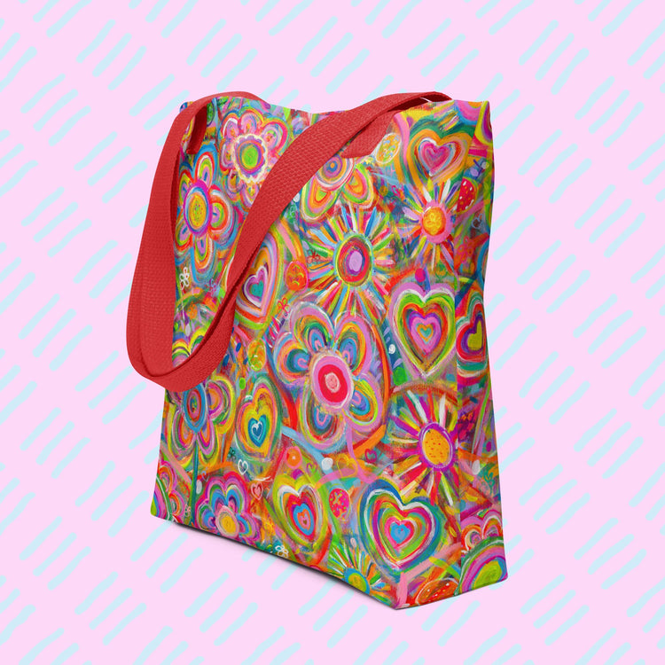 The Love in Neon Tote Bag by My Favourite Colour is Rainbow features my Love in Neon painting, with vibrant heart and abstract flower designs in pinks, greens, yellows, and blues. Its spacious, hard-wearing design includes sturdy red handles making it the perfect work tote.