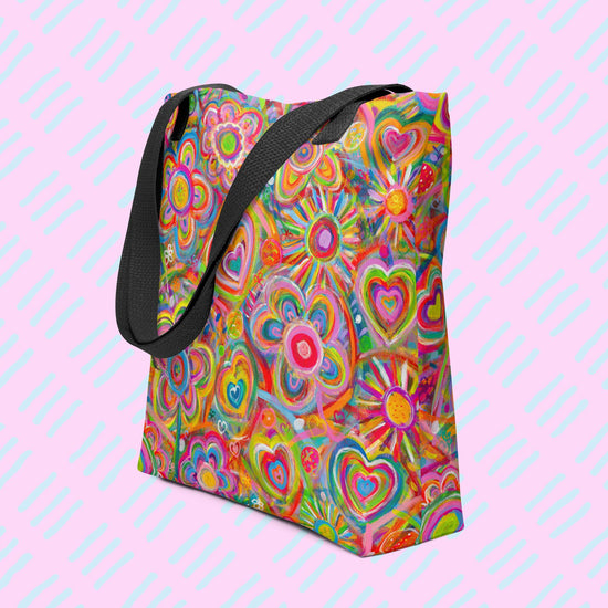 The Love in Neon Tote Bag by My Favourite Colour is Rainbow features my Love in Neon painting, with vibrant heart and abstract flower designs in pinks, greens, yellows, and blues. Its spacious, hard-wearing design includes sturdy black handles making it the perfect work tote.