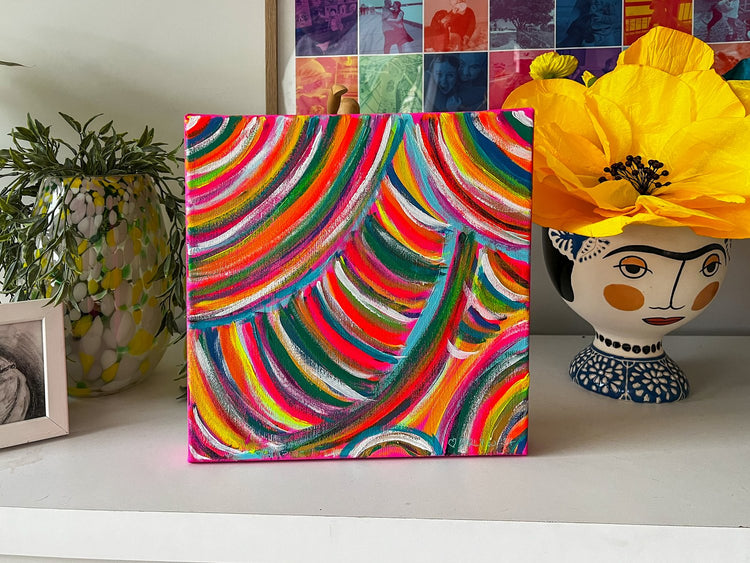 The Neon Candy Floss original painting from My Store features vibrant swirls and a vase with a face design holding a bold yellow flower, while small photograph collages in the background add intrigue to this acrylic on canvas masterpiece.