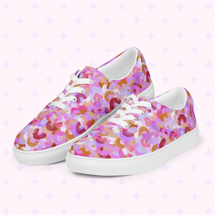 Discover our Pink Rainbow Canvas Sneakers by My Favourite Colour is Rainbow, featuring a vibrant abstract design in pink, purple, and brown on a comfortable white sole with a backdrop of subtle purple stars.