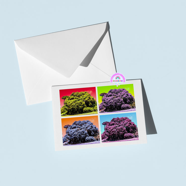 A vibrant pop art image of New Zealands Pohutukawa tree in green, red, blue, and purple decorates the Pohutukawa Pop Art greeting card (Version 1) from My Store, featuring a matching white envelope on a light blue background. Logo: BARBOW at the top right corner.