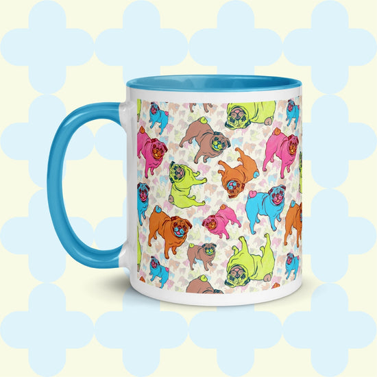 The Pugalicious Mug by My Favourite Colour is Rainbow delights pug lovers with colourful pug illustrations in orange, pink, green, blue, and brown. This version has a light pink handle and interior.