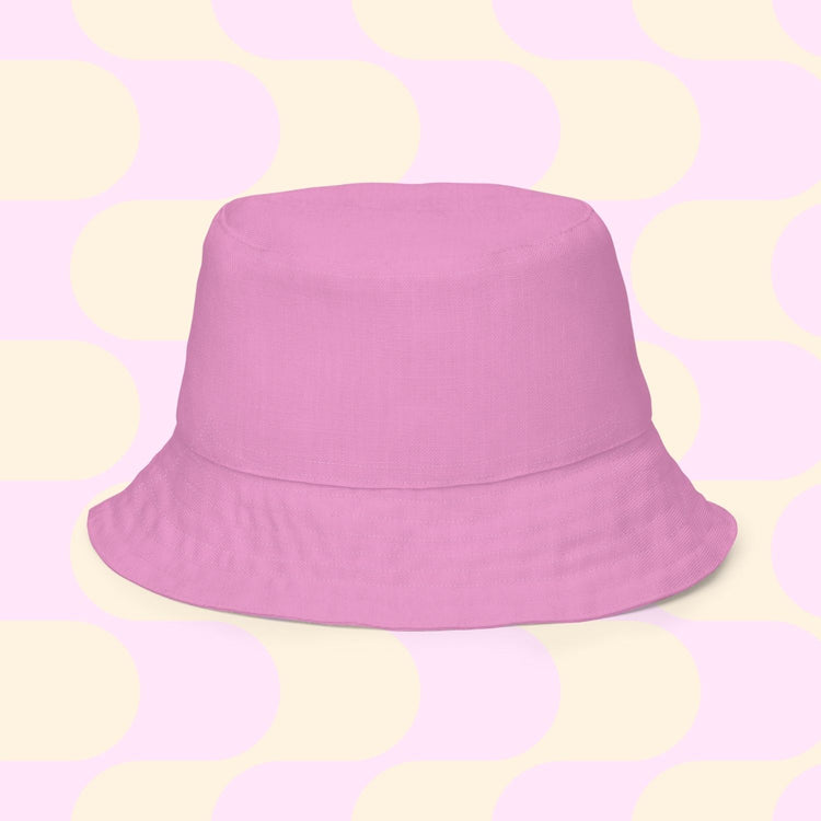 Centered on a pastel backdrop with cream and pink circles and rectangles, the chic Splotches and Crosses reversible bucket hat by My Favourite Colour is Rainbow, comes in multiple sizes. Perfect for matching your Style BFF on sunny days.