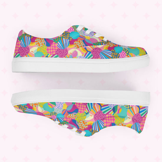 The Squiggs and Stripes Canvas Sneakers by My Favourite Colour is Rainbow combine vibrant style with a colorful abstract print of geometric shapes, swirls, and floral designs in pink, blue, green, orange, and yellow on a light background.