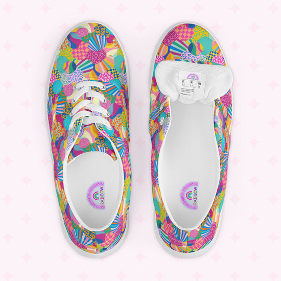 The Squiggs and Stripes Canvas Sneakers by My Favourite Colour is Rainbow feature a vibrant floral, shapes, and abstract design with white soles and laces. The soles are branded SEAN WOTHERSPOON and ADIDAS, while rainbow accents adorn the insole.