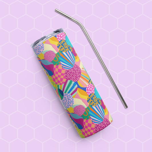 The Squiggs and Stripes Stainless Steel Tumbler by My Favourite Colour is Rainbow, featuring abstract geometric patterns in blue, pink, yellow, and green, sits on a light purple hexagon patterned background with a sleek metal straw.