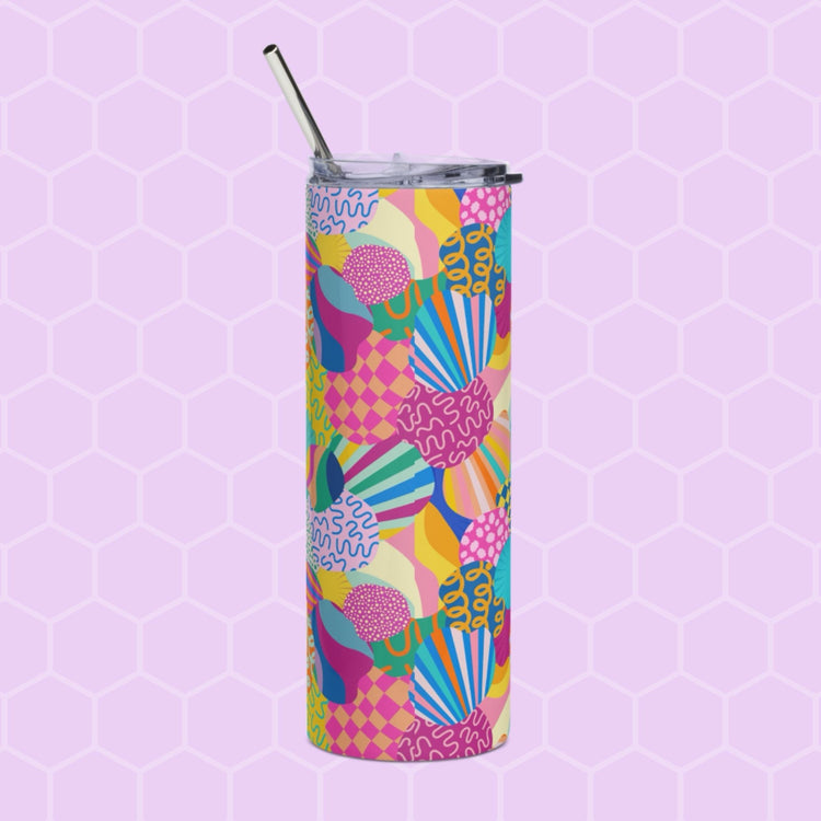The Squiggs and Stripes Stainless Steel Tumbler by My Favourite Colour is Rainbow features a tall design with a metal straw, showcasing a colorful abstract pattern of scallops, dots, and lines in pink, blue, yellow, and green against a light purple hexagonal grid.