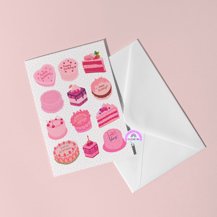 The Sweet Treats Birthday Card by My Store, featuring delightful cake designs and Happy Birthday messages, rests atop a partially open white envelope on a soft pink background.