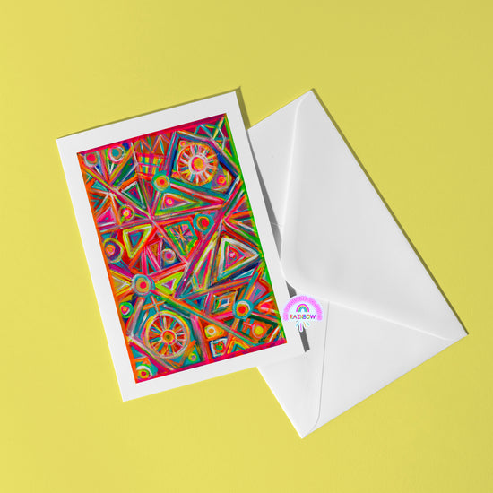 The Tropical Geometry Greeting Card by My Store features bold abstract patterns in reds, greens, and purples on a yellow background. Accompanying it is a white envelope with a RAINBOW sticker, embodying the collections vibrant spirit.