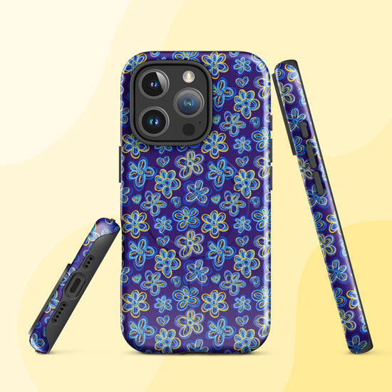 The Bloomscape MagSafe iPhone Case by My Favourite Colour is Rainbow features a dual-layer design with a blue and yellow floral pattern. Its impact-resistant, MagSafe compatible, and displayed from back, side, and bottom angles.