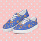 The Blue Summer Sorbet Canvas Sneakers by My Favourite Colour is Rainbow feature cut outs of my Summer Sorbet print in a fun mix of suns, rainbows, ice creams and other abstract shapes, set against a striking blue backdrop.  The shoes are complemented by white laces and soles.  Shown against on a pink backdrop with white diamonds