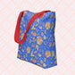 The Blue Summer Sorbet Tote Bag by My Favourite Colour is Rainbow features summery patterns in my Summer Sorbet design on a royal blue background.  This version has sturdy red handles.