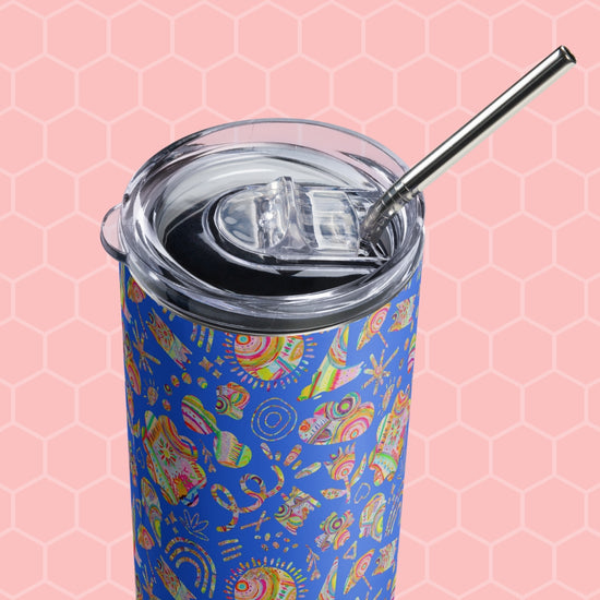 The Blue Summer Sorbet Stainless Steel Tumbler by My Favourite Colour is Rainbow stands against a pink hexagonal background, showcasing its vibrant abstract pattern. It comes with a clear lid and metal straw, crafted for durability and style.