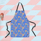 Introducing the Blue Summer Sorbet Apron by My Favourite Colour is Rainbow, crafted from featuring a vibrant abstract pattern on a blue background. It pairs perfectly with the white container holding kitchen utensils.