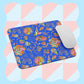 The Blue Summer Sorbet Mouse Pad by My Favourite Colour is Rainbow features vibrant abstract and geometric patterns, with swirls, rainbows, and shapes on a blue backdrop. A white mouse sits atop the pastel checkered design background.