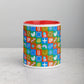 The Colour Block Mug by My Favourite Colour is Rainbow features a red interior with a geometric design in blue, green, red, and orange. It rests on a light gray surface against a plain gray background, highlighting its vivid mix of colors and patterns.