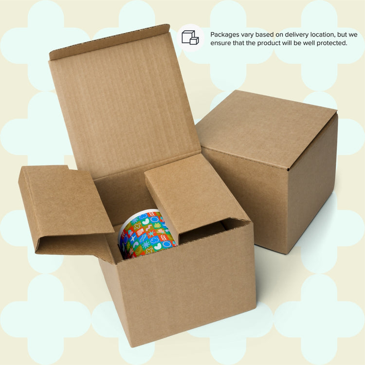 The scene shows two open cardboard boxes: one holds a colorful roll of tape with vibrant symbols, while the other is closed with a note saying, Packages vary by location, but your Colour Block Mug by My Favourite Colour is Rainbow will be well protected.