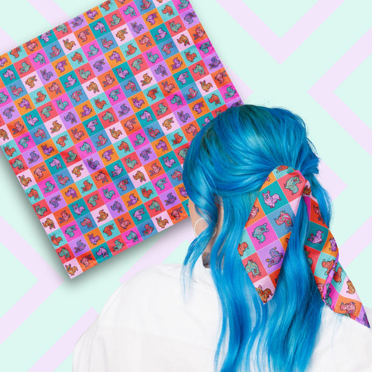 Two views of the 'Crazi Corgis' Bandana by My Favourite Colour is Rainbow.  At top left, a flat lay of the bandana.  At bottom right, a person with vibrant blue hair is seen from behind, wearing the bandana in her hair.