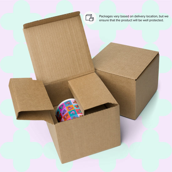 Two cardboard boxes are shown, one open with a colorful tape roll featuring playful designs. A note mentions packaging varies by location for protection. The pastel backdrop hints at the Crazi Corgis Mug from My Favourite Colour is Rainbow—a must-have for coffee lovers.