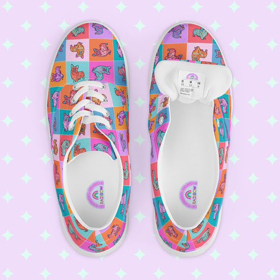 My Favourite Colour is Rainbows Crazi Corgis Canvas Sneakers are colourful lace-up shoes decorated with a pop art corgi design.  The inside of the shoe is white with My Favourite Colour is Rainbow branding on the footbed.  They have white laces and soles.
