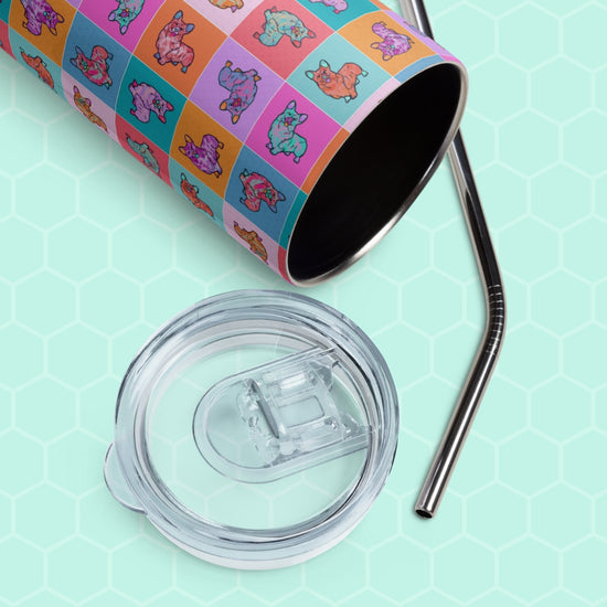 The Crazi Corgis Stainless Steel Tumbler by My Favourite Colour is Rainbow showcases a grid of cartoon sloths with a transparent lid and metal straw, lying on its side against a light teal, hexagonal patterned background.