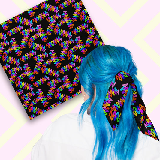 Two views of the 'Electric Zigzag' Bandana by My Favourite Colour is Rainbow.  At top left, a flat lay of the bandana.  At bottom right, a person with vibrant blue hair is seen from behind, wearing the bandana in her hair.