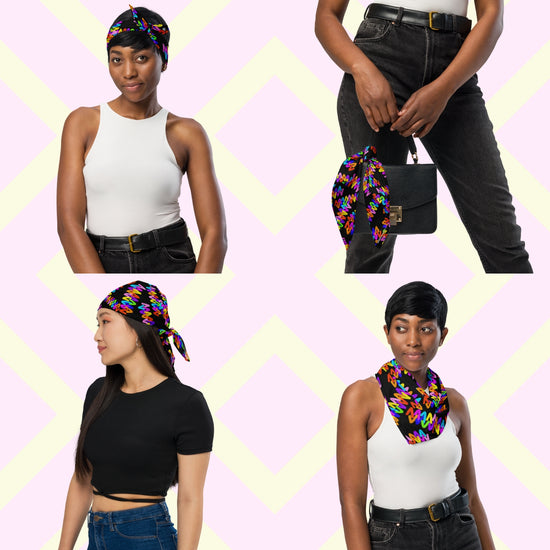 Four women model the Electric Zigzag Bandana by My Favourite Colour is Rainbow. They style this colourful accessory as a headband, neck scarf, hair wrap, and on a handbag, all against a pastel zigzag backdrop.