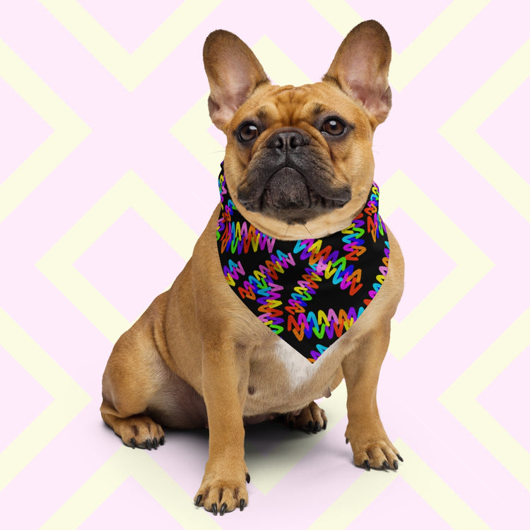 A brown French bulldog sports the Electric Zigzag Bandana from My Favourite Colour is Rainbow, with a colourful zigzag pattern suited for any occasion. 