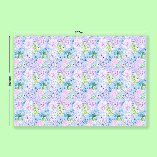 My Favourite Colour is Rainbows Floral Wrapping Paper Sheets measure 707mm by 500mm, featuring pastel pink, lavender, and green flowers on a light blue background.