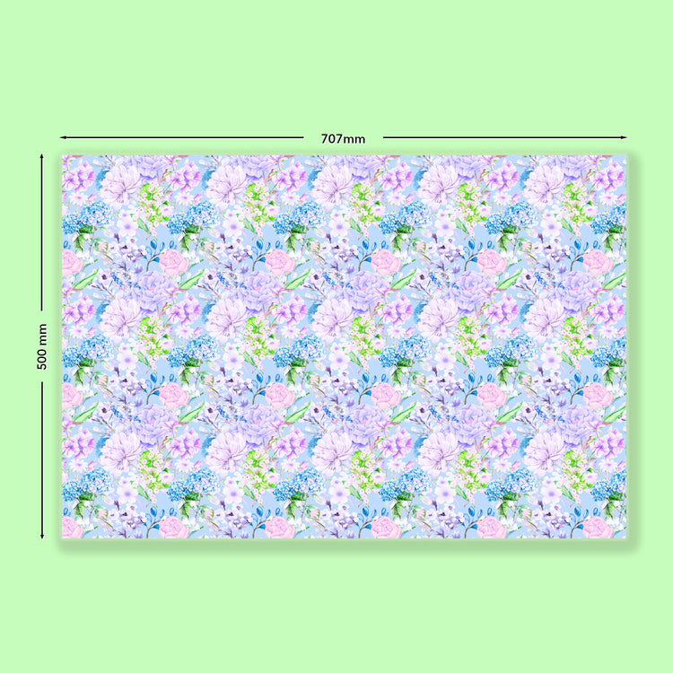 My Favourite Colour is Rainbows Floral Wrapping Paper Sheets measure 707mm by 500mm, featuring pastel pink, lavender, and green flowers on a light blue background.