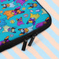 A close up of the 'Frenchie Fetch, Set, Match Laptop Sleeve' by My Favourite Colour is Rainbow, featuring colourful cartoon French Bulldogs with tennis balls on a bright blue backdrop. It is finished with a black double zipper.  The print is on only one side of the laptop sleeve, the other side is black.