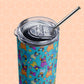 The Frenchie Fetch, Set, Match stainless steel tumbler by My Favourite Colour is Rainbow features a clear lid, metal straw, and a colorful pattern of playful cartoon dogs and tennis balls on a pastel hexagonal background.