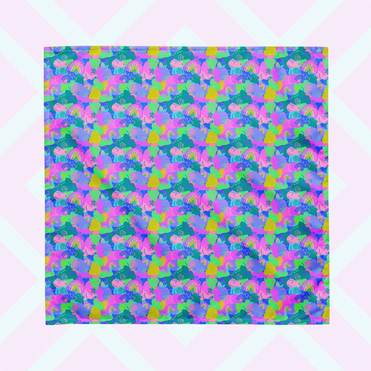 The Funfetti Bandana by My Favourite Colour is Rainbow features an abstract pattern with vibrant swirls, rainbows and stars in blue, pink, purple and green.