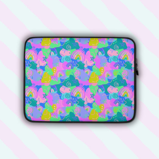 The Funfetti Laptop Sleeve by My Favourite Colour is Rainbow features a vibrant design of pink, green, blue, and purple rainbows, swirls and abstract shapes.  The print is on only one side of the laptop sleeve, the other side is black.